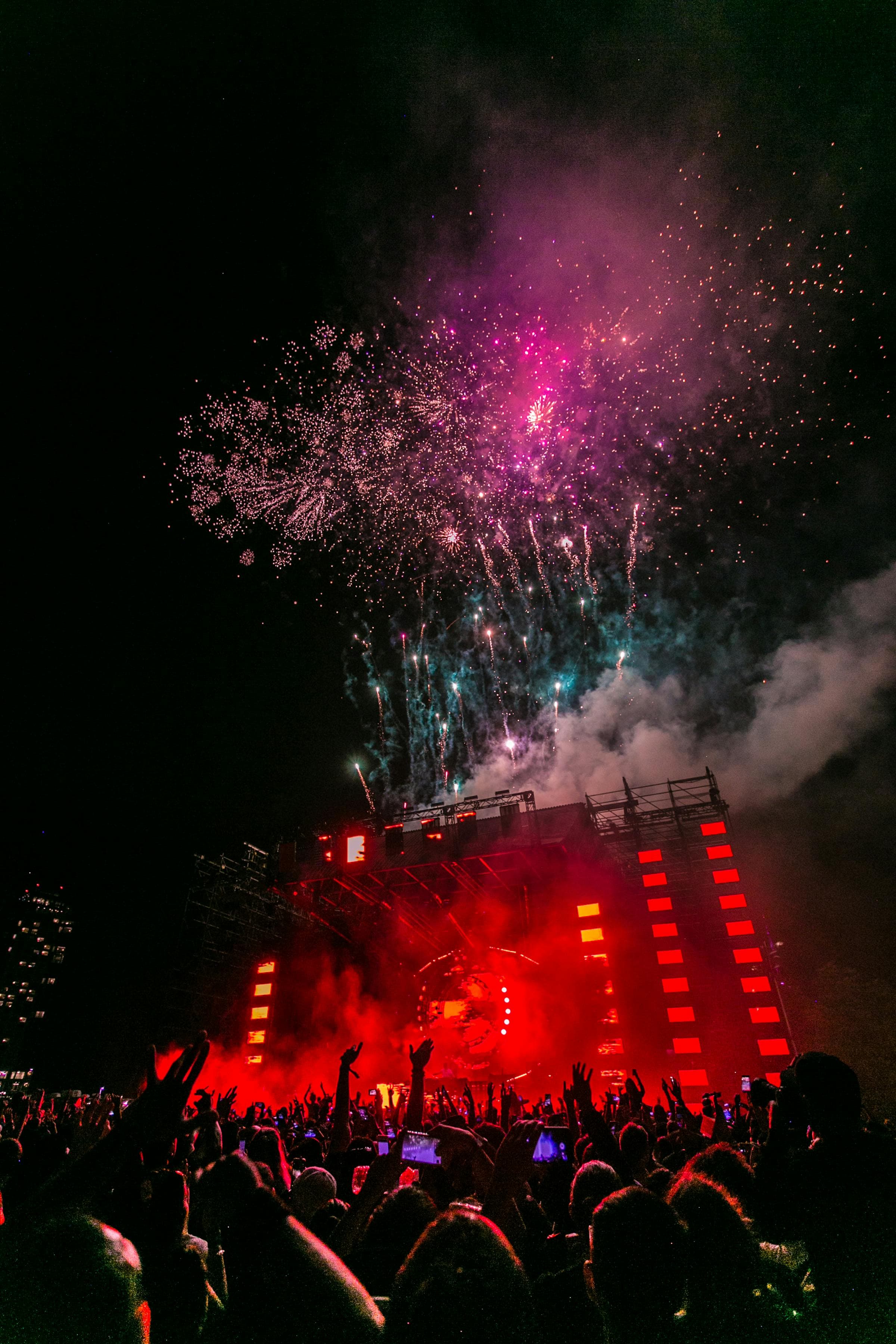 Concert crowd with raised hands