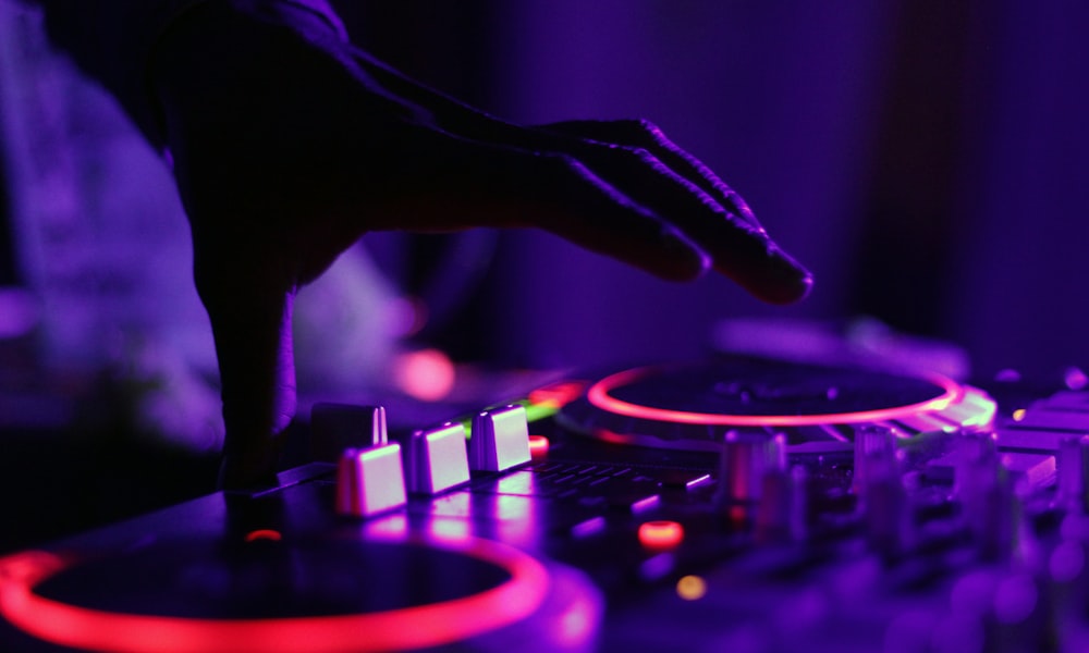 DJ mixing board with colorful controls, focus and flow